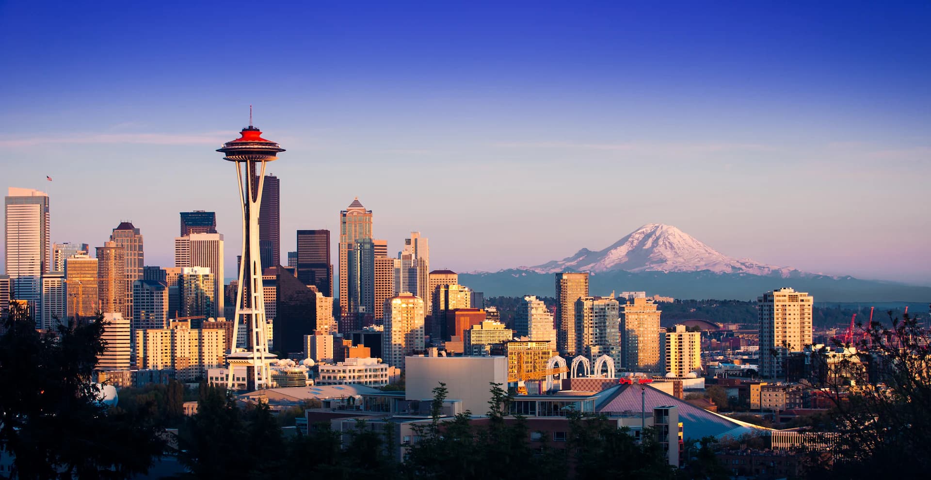 Seattle skyline with the Space Needle and Mount Rainier at golden hour